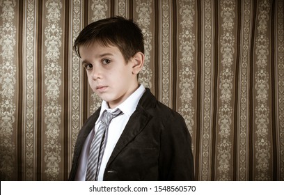 Boy In Vintage Black Suit And Tie. Vintage Style Kid.