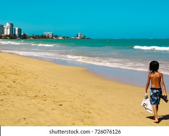 A Boy Walking On Carolina Beach Puerto Rico