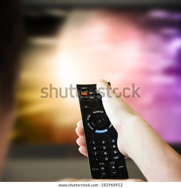  boy is\
watching a television screen with his\
back