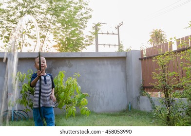 Boy Watering Garden With Sunset,Attention Deficit Hyperactivity Disorder,ADHA Child Activity Therapy