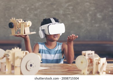 A Boy Wearing 3D Gadget And Holding The Simulation Mechanism Robot Model Wooden With Contemplating A Real Simulation In Classroom.cyber Love