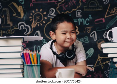 boy wearing headphones studying online