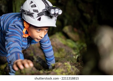 Boy Wearing Helmet For Caving Inside Caves