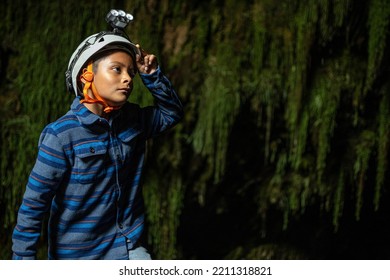 Boy Wearing Helmet For Caving Inside Caves