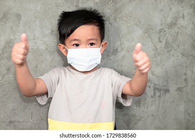 A Boy Wearing Medical Face Mask For Pollution Or Coronavirus,child Itchy Eyes And Nose, Kid Scratching Nose While Wearing Protection Mask.Protection Against Contagious Disease, Coronavirus.