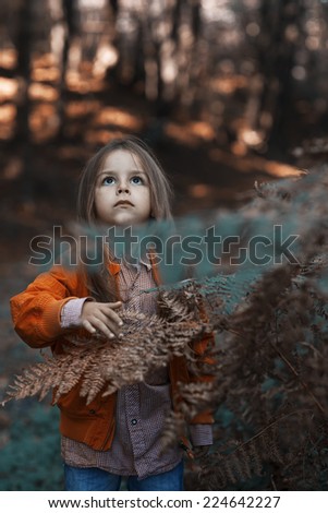 Similar – Foto Bild fröhlich lustiges Kind Mädchen isst frischen Apfel im Herbst