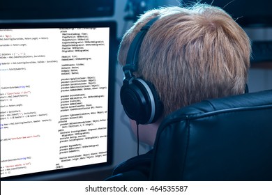 Boy Working On Computer Listening To Music