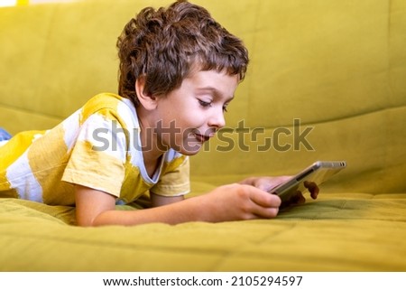 Similar – Little boy using a tablet