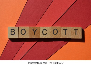 Boycott, word in wooden alphabet letters isolated on red background - Shutterstock ID 2147045627