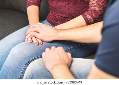 Boyfriend apologize to girlfriend. Couple support each other. Comforting or telling bad news. Young man holding hand and comforting woman. Apology and forgiveness concept.