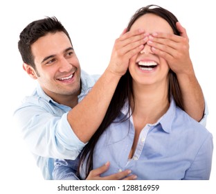 Boyfriend Covering The Eyes Of His Girlfriend For A Surprise - Isolated