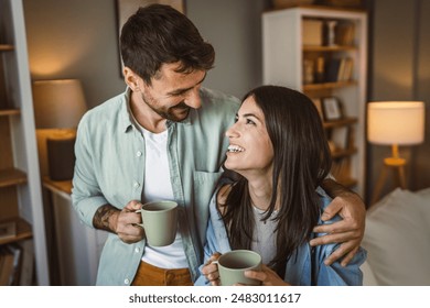 Boyfriend and girlfriend husband and wife drink coffee and enjoy at home - Powered by Shutterstock