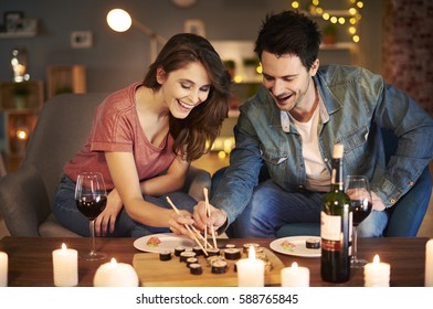 Boyfriend and girlfriend trying Asian food 