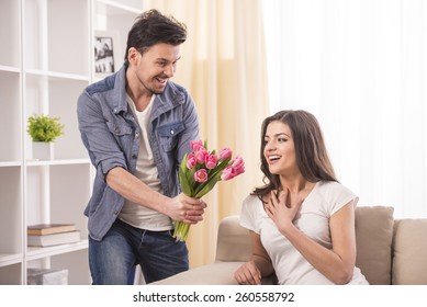 Boyfriend Is Giving Flowers To His Beautiful Girlfriend At Home.