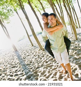 Boyfriend Giving Girlfriend Piggy Back Ride