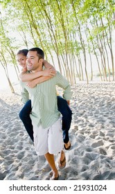 Boyfriend Giving Girlfriend Piggy Back Ride