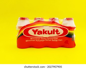 Boyolali, Indonesia - August 20 2021: Yakult Fermented Milk Drink On Yellow Background Isolated. Healthy Probiotic Drink With Lactobacillus Paracasei Shirota Strain Of Bacteria.