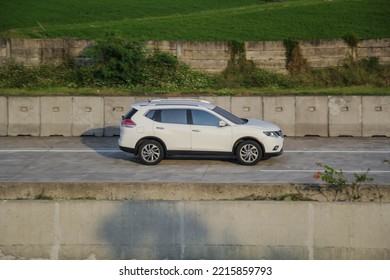 Boyolali Indonesia September 2 2022 Nissan X-Trail Or Nissan Rogue SUV Driving Fast On Trans Jawa Highway Blurry In Motion