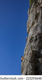boys climbing on a crag in abruzzo (central italy) in a wonderful sunny day with a clear sky. Sport climbing in the open air on a mountain near Tagliacozzo to train for a sporting competition. - Shutterstock ID 2232936481