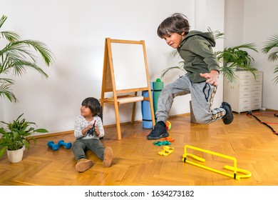 Boys Crossing Over Hurdle Bar