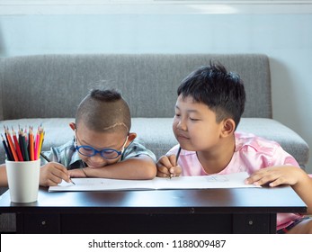 Boys With Disability, Brain Disorders And Left Eye Is Not Visible From Brain Surgery. Have Fun, Enjoy Drawing Or Write In Book With Friends At Home.