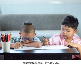 Boys With Disability, Brain Disorders And Left Eye Is Not Visible From Brain Surgery. Have Fun, Enjoy Drawing Or Write In Book With Friends At Home.