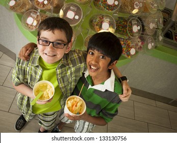 Boys Eating Frozen Soft Serve Yogurt.