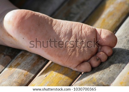 The Boys Feet Are Full Of Dust After Running In The Garden The Boys Feet Are Full Of Dust After Running In The Garden