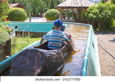 Boys Floats In Lazy River