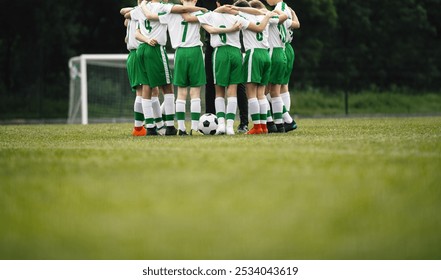  Boys Football Team. Teenage Boys Huddling Together in a Circle on Grass Field. Kids in Sports Team in Building Team Spirit Before The Soccer Game - Powered by Shutterstock