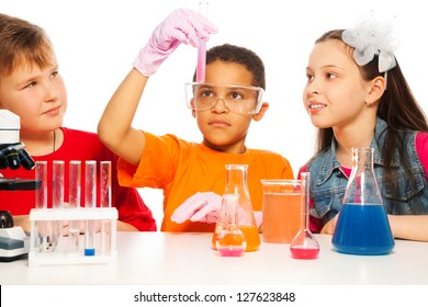 Boys and girls learning chemistry and conduct experiments