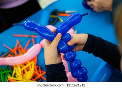 Boy's Hands With Balloon On Twisting Art Workshop