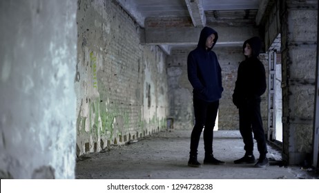 Boys In Hoodie Talking In Ruined Building, Teenage Gang, Young Criminals