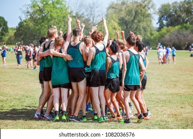 Boys On Cross Country Team In A Huddle