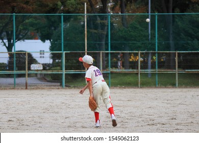 Boys Playing Baseball At A Ball Yard