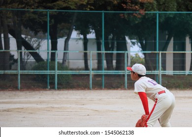 Boys Playing Baseball At A Ball Yard