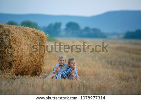 Similar – Vater und Sohn sitzen im Park.