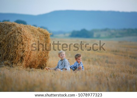 Similar – Vater und Sohn sitzen im Park.