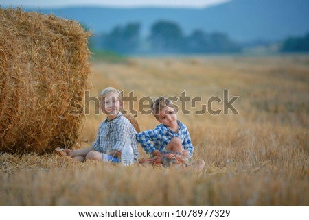 Similar – Vater und Sohn sitzen im Park.