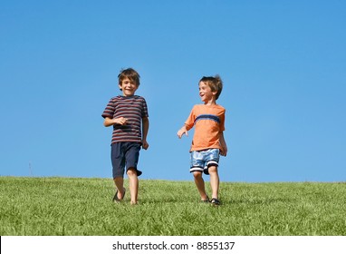 Boys Running Down A Hill
