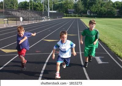 Boys Running On Race Track