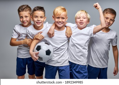 Boys Soccer Team Celebrating A Victory After Match, Motivated Children Sports Team Rising Hands Up