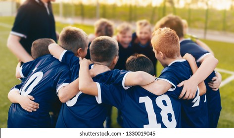 Boys Sport Team Huddle. Kids Of Soccer Team Gathered Before The Tournament Final Match. Coach And Young Football Players Huddling. Sports Competition For Children