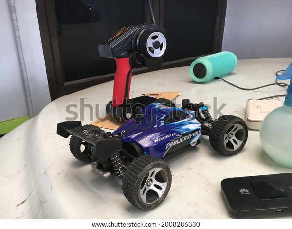 Boys toys, a\
remote controlled car and a\
speaker