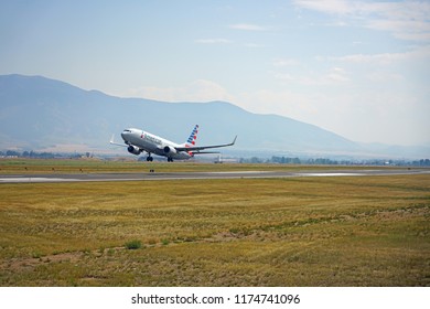 BOZEMAN, MT -7 SEP 2018- View of a plane from American Airlines (AA) taking off at the Bozeman Yellowstone International Airport (BZN), in Gallatin County, Montana near Yellowstone National Park.