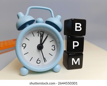 BPM Business Process Management with Alarm Clock – Time Management and Workflow Optimization Concept for Business Planning and Organizational Efficiency.  - Powered by Shutterstock - Get 15% off with code: PIKWIZARD15