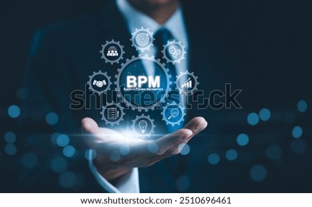 BPM Concept. Business Process Management, Businessman presents digital interface representing business process management (BPM) with icons processes, efficiency, and growth in a corporate setting,