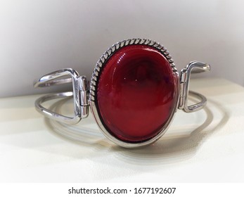 A Bracelet With Large Red Mexican Amber In A Silver Frame. Photo For Decoration Jewelry Store.