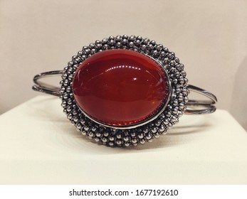 A Bracelet With Large Red Mexican Amber In A Silver Frame. Photo For Decoration Jewelry Store.