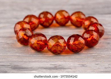 Bracelet of natural brandy amber, beads with a diameter of 18mm diamond cut, in bracelet 12 beads
